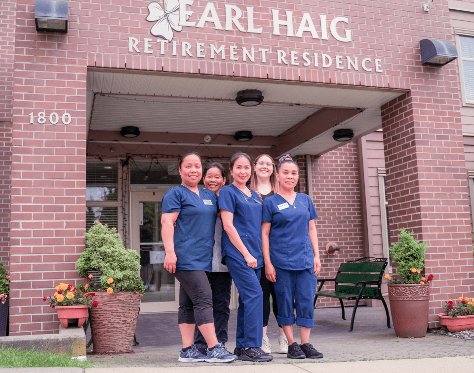 The wonderful staff memebers of SF Care Services standing outside the Earl Haig Retirement Residence