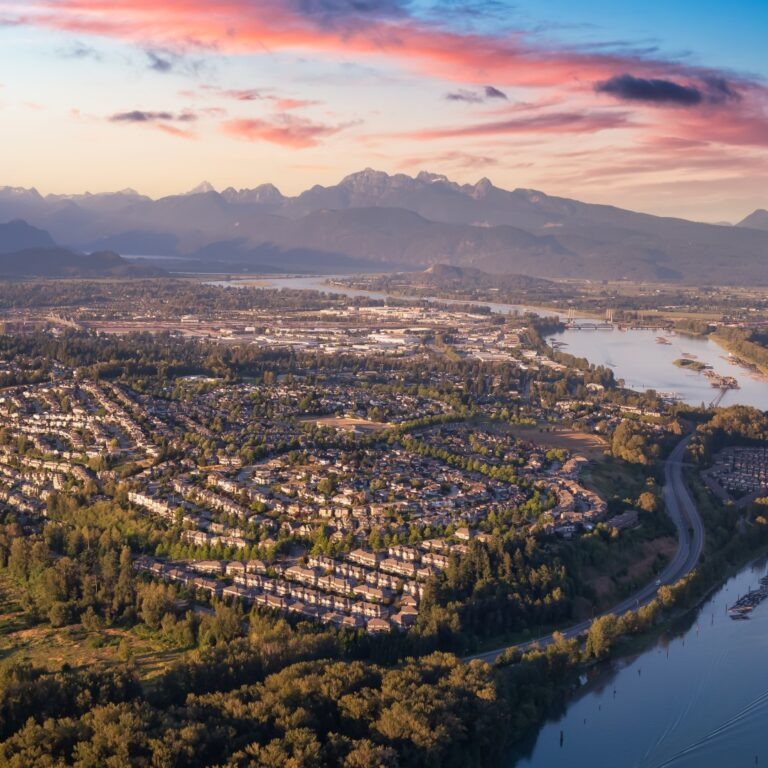 Aerial view of a residential neighbourhood with senior independent living in Coquitlam at sunset.