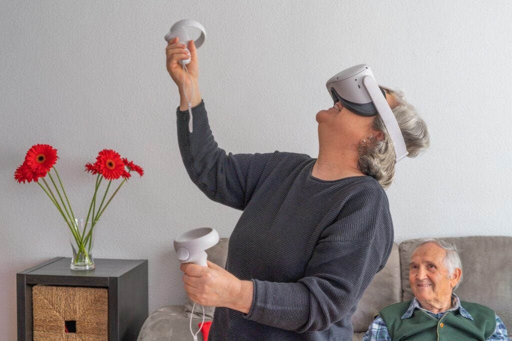 Mature woman explores a VR world in her living room