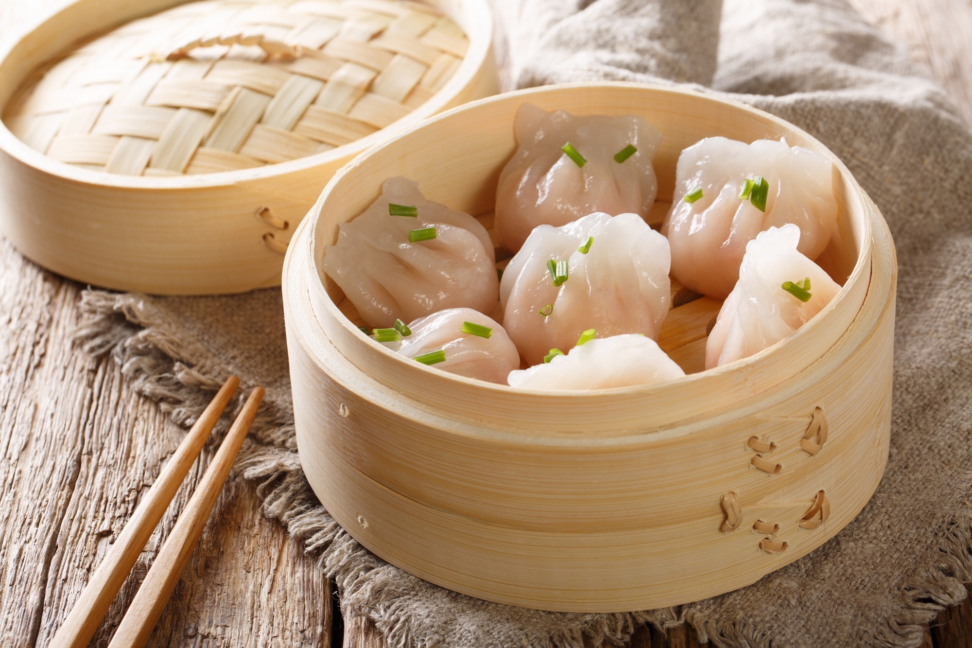 Steamed shrimp dumplings dim sum close-up on the table.
