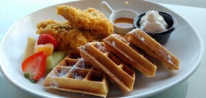 Sweet waffles with seasonal fruit and fried chicken from Kook’s Cooks