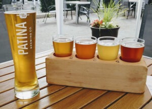 Enjoying a beer flight on the outdoor patio at Patina Brewing in Port Coquitlam