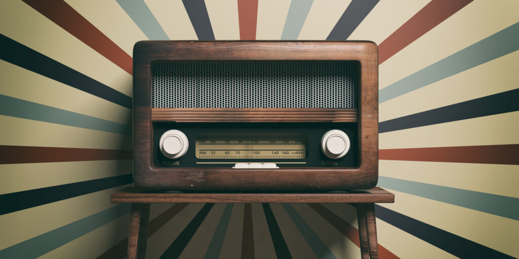 3D illustration of an old fashioned radio on a wooden table