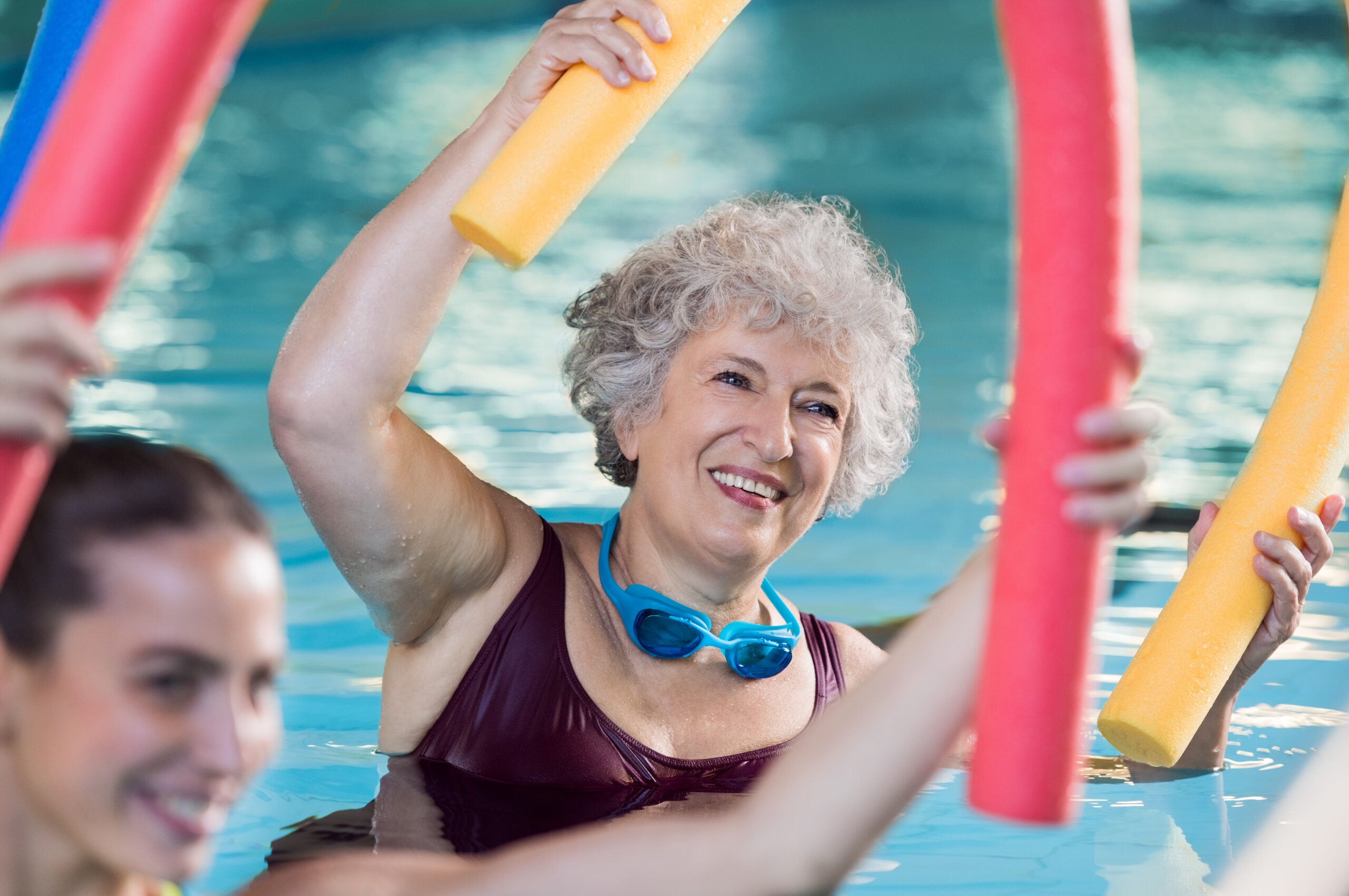 Senior lady enjoying a session of water aerobics