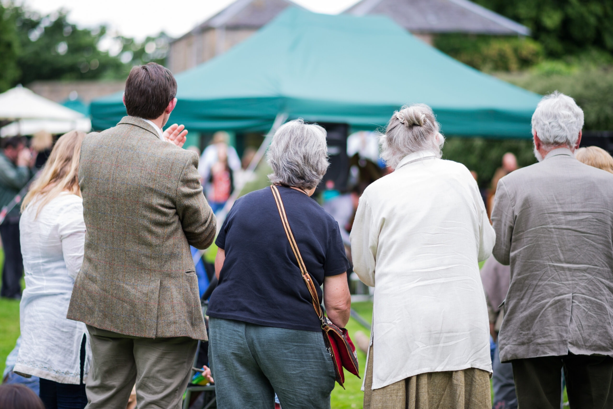 Group of seniors enjoying an outdoor community event