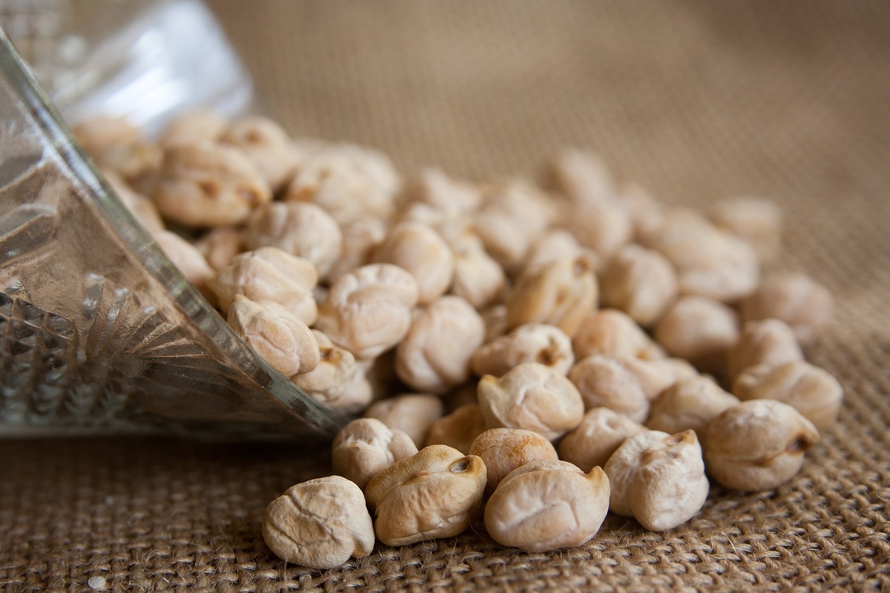 Chickpeas strewn across a hemp sack