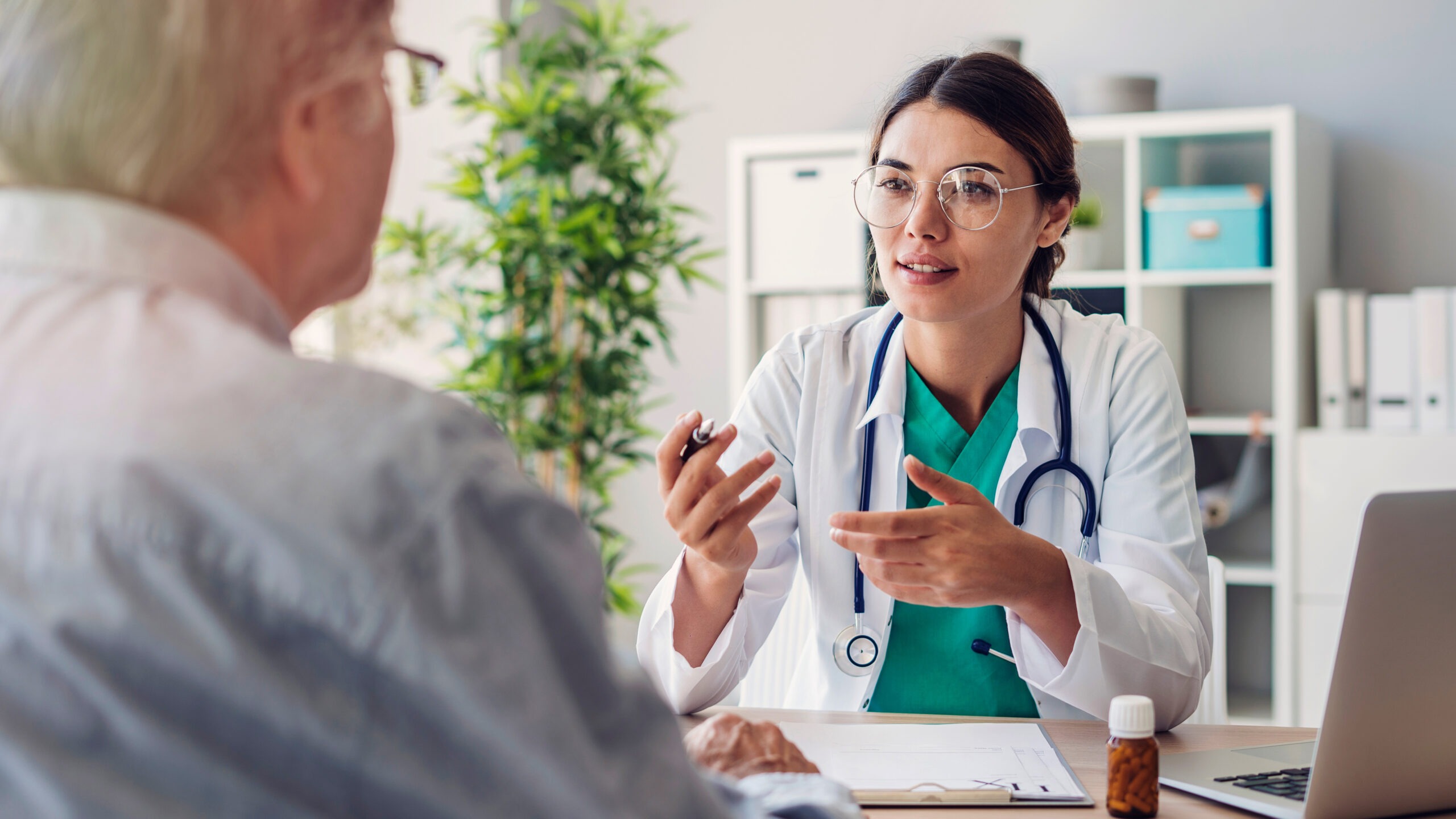 Doctor and patient are discussing preventive health screening at the clinic