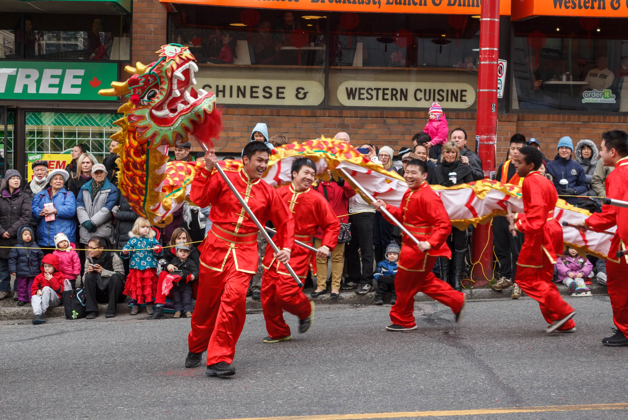 People playing dragon dance for Chinese New Year in Chinatown