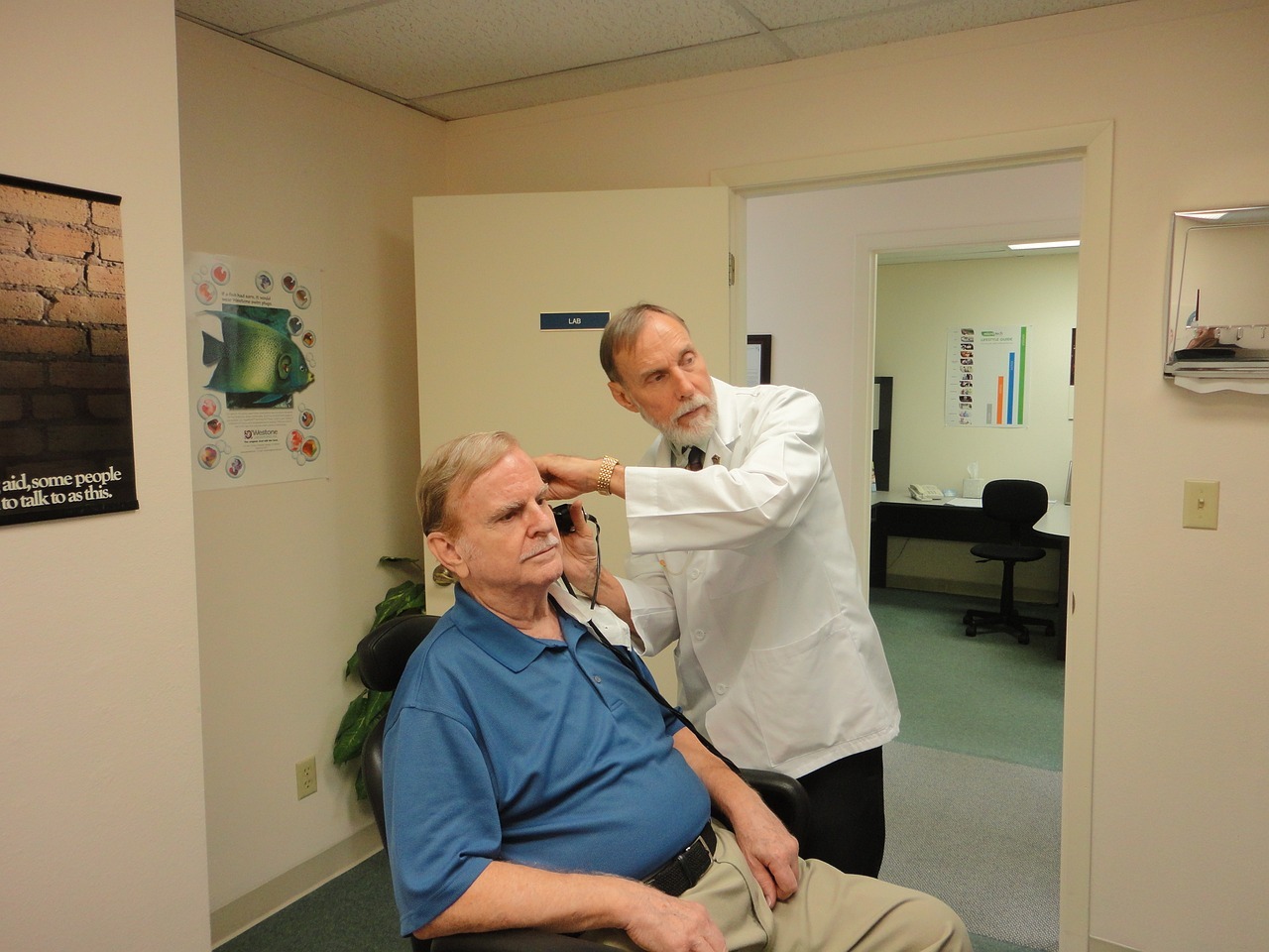 Senior man at an audiologist having his hearing tested