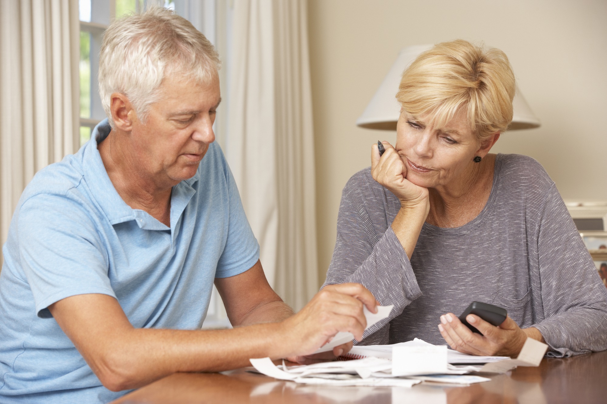 Senior couple budgeting their finances
