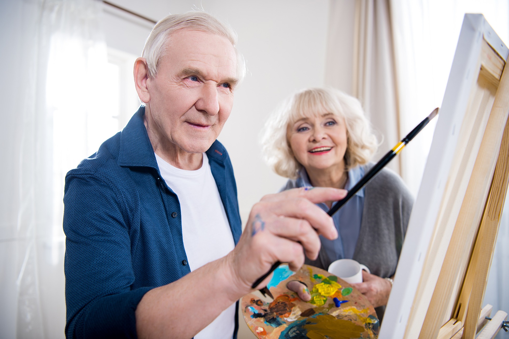 Senior couple painting