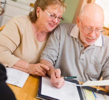 Seniors consulting a financial planner about managing retirement income