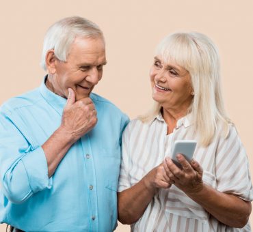 Elderly senior couple using smartphone