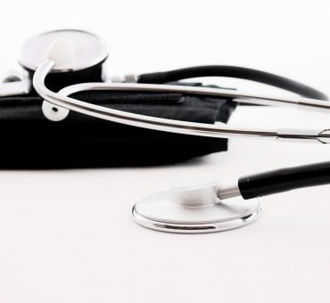 Close-up of a stethoscope and blood pressure cuff for preventive health screenings