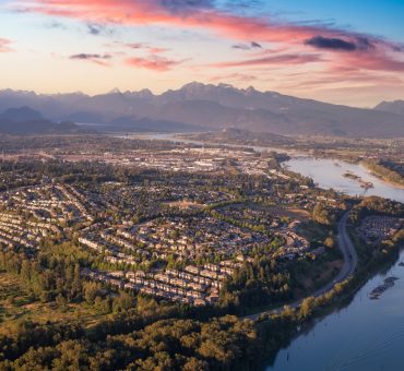 Aerial view of a residential neighbourhood with senior independent living in Coquitlam at sunset.